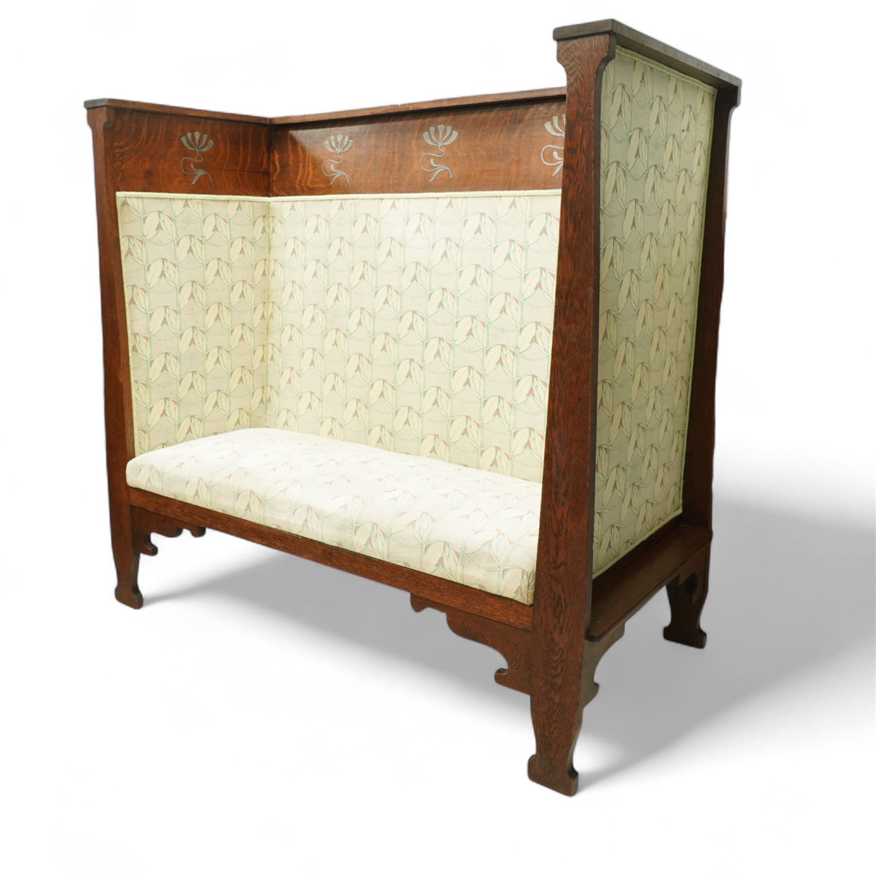 James Shoolbred & Co. (1814-1934) - Arts & Crafts high-back oak settle or hall-bench, the projecting cresting rail over a frieze decorated with stylised poppy pewter inlays, the drop-in sprung seat beneath high back and arms, flanked by tapering uprights terminating to shaped stile feet, upholstered in Archibald Knox patterned fabric with the original tapestry and horsehair upholstery beneath, applied plaque by James Shoolbred to underside, with stamped serial number W1573, circa 1890