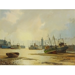  Don Micklethwaite (1936-): Beached Fishing Boats in Scarborough Harbour, oil on canvas signed 29cm x 38cm  