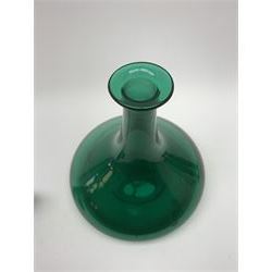19th century green glass ships decanter with flat topped stopper, H21.5cm, together with a set of four 19th century green glass wine glasses, the funnel bowls upon bladed knopped stems and circular feet, H13cm