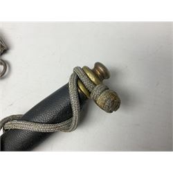 German Paul Weyersberg & Co Solingen DLV flyers dagger with 18cm steel blade, plated brass/tombac downswept cross-piece and pommel and leather covered grip, in leather and plated brass/tombac scabbard with leather hanger strap and silvered knot L35cm overall. Auctioneer's Note: After WWI Germany was forbidden an air force by the Treaty of Versailles however the Deutscher Luftsport-Verband (German Air-sport Association) was formed in March 1933 from various sports flying clubs and had branches for aeroplane, gliding and balloon flying. Under cover of the sporting DLV, many future Luftwaffe pilots trained to fly. DLV was embodied with the NSKK in March 1935 and on 1st March 1937 Luftwaffe was formed.