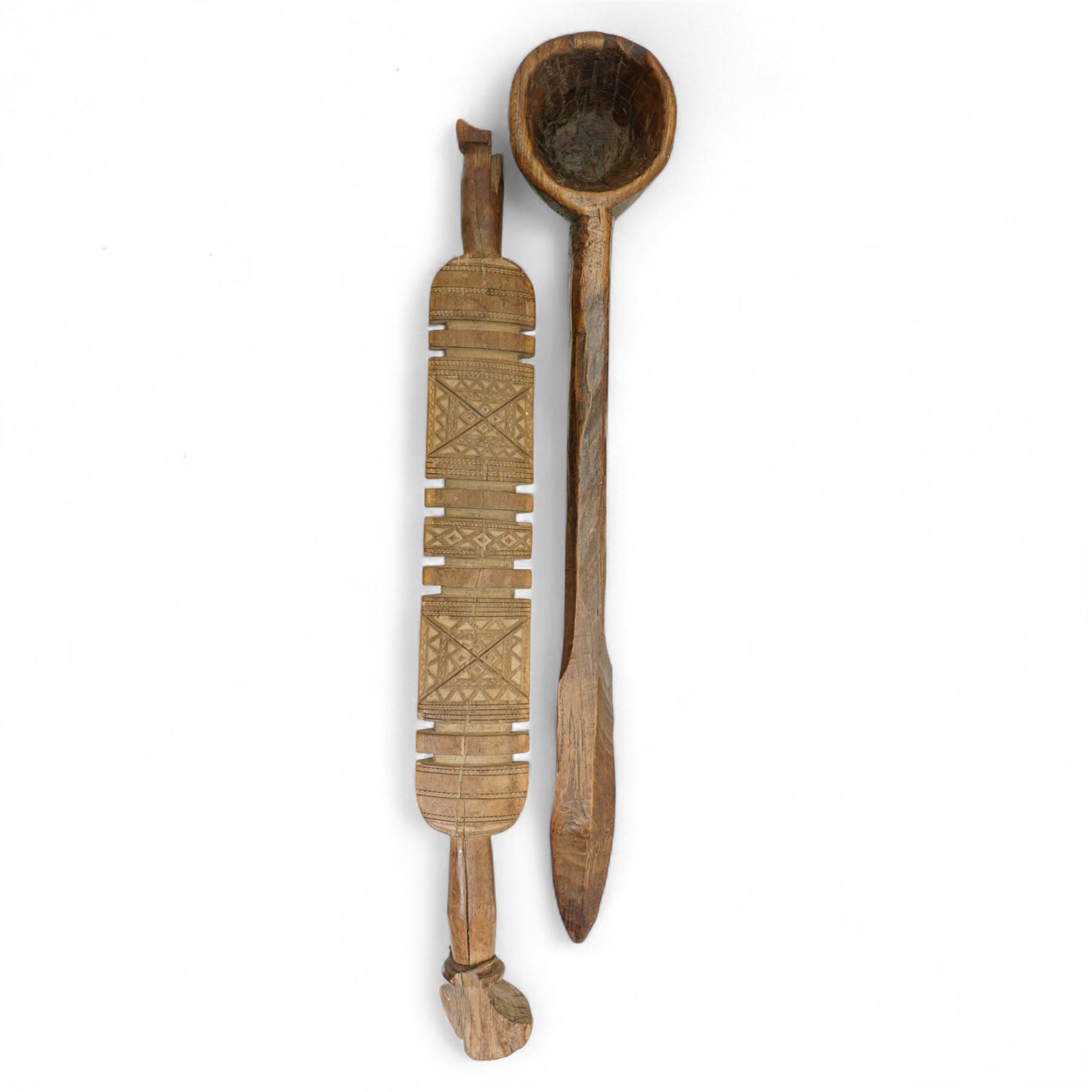 Large African treen grain spoon L62cm; carved wood Berber Tuareg tent peg, West African painted tribal mask 95cm and an Aboriginal wood panel carved with emus and snakes, possibly a bull roarer L82cm (4)