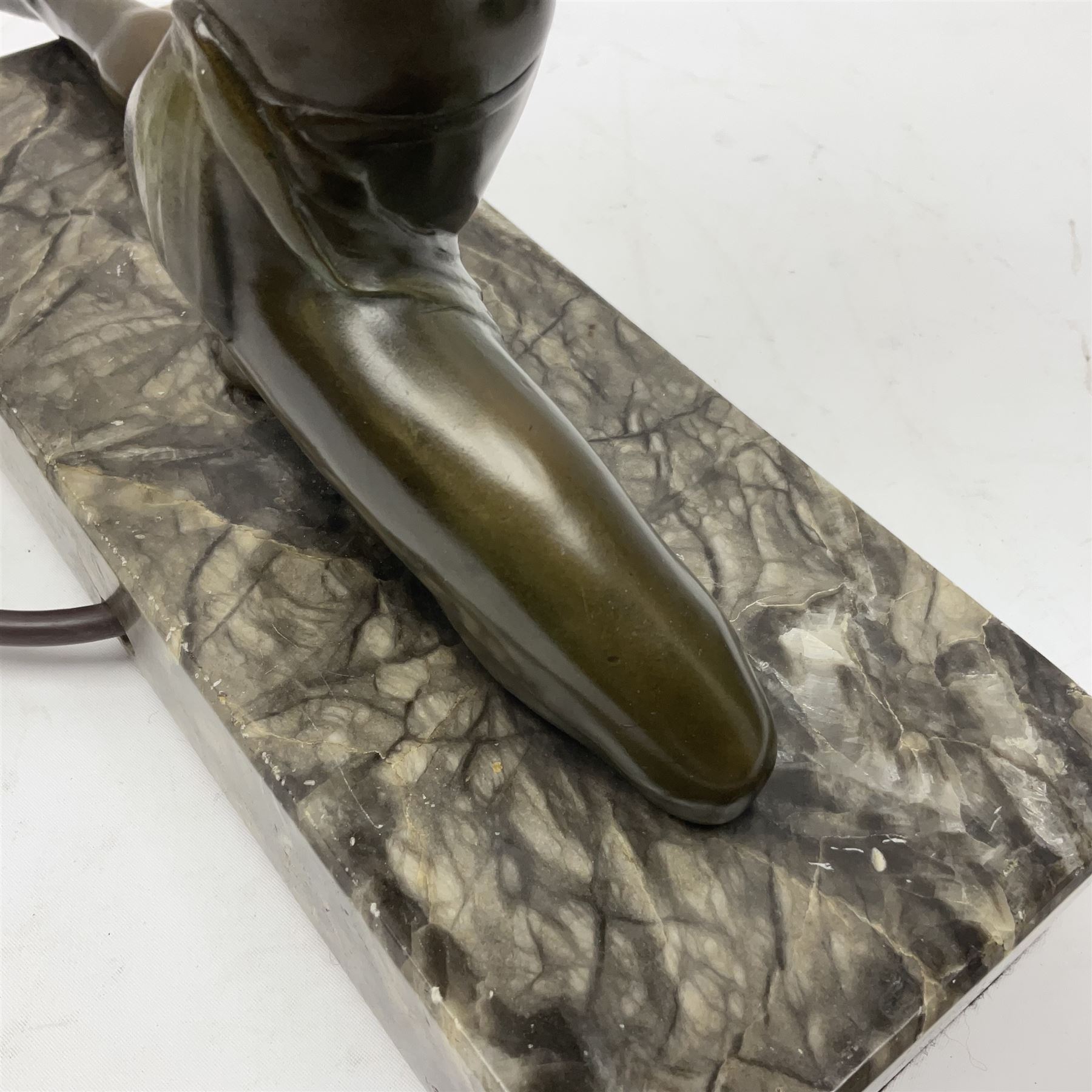 1930s Art Deco spelter table lamp, modelled as a nude woman holding aloft a spherical crizzled glass shade, upon a marble base, H48cm