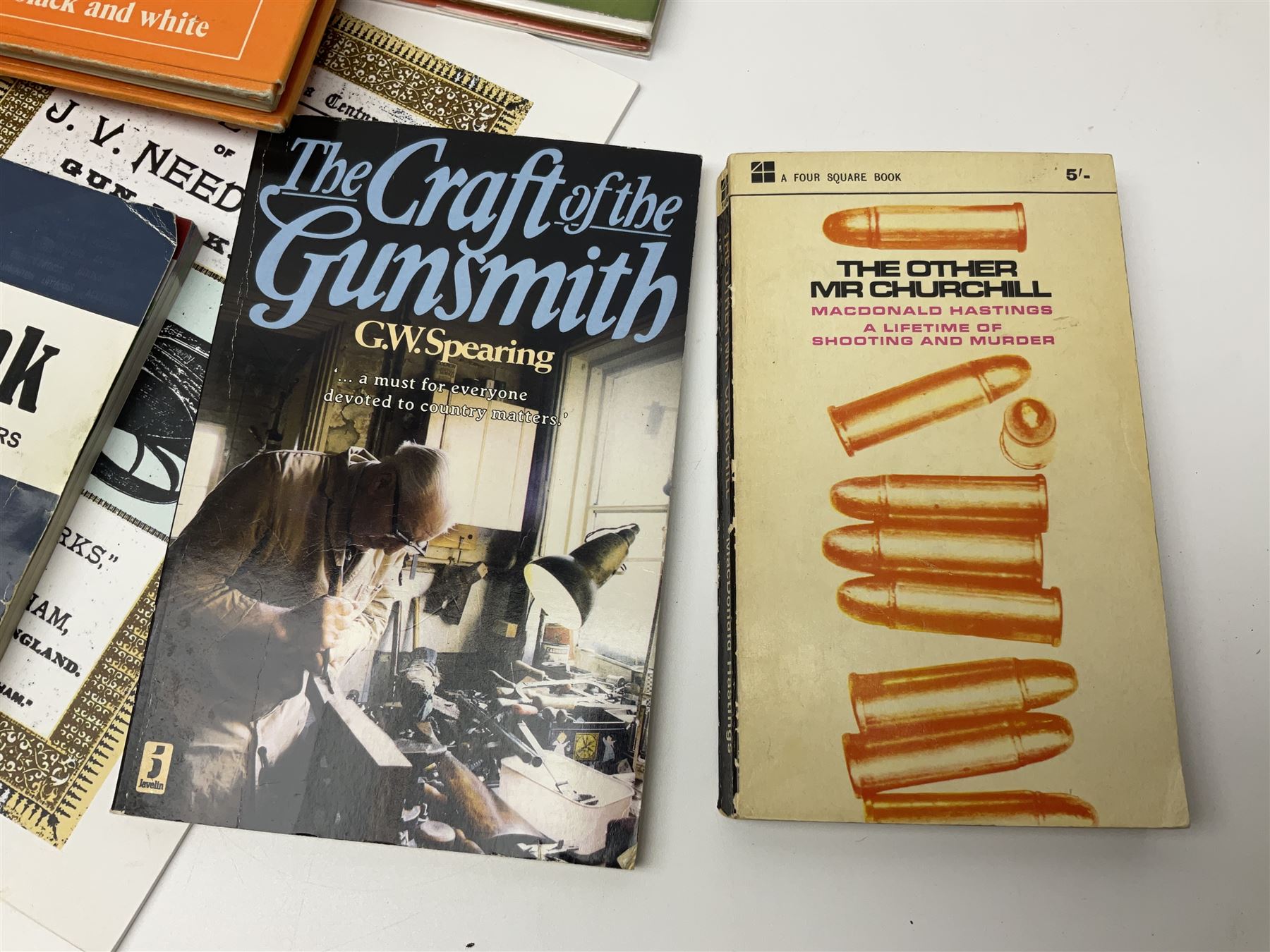 Collection of books, pamphlets and catalogues on guns and shooting including Colin Greenwood: Rook & Rabbit Rifle. 2006; Frank de Haas: Bolt Action Rifles. 1984 and Single Shot Rifles and Actions. 1969; Ian Skinnerton: .577 Snider-Enfield Rifles and Carbines. 2003 and two Small Arms Identification Series booklets; two Collectors Guides on Air Rifles by D.E. Hiller etc; and Bruce Bairnsfather Bystander's Fragments From France No.4