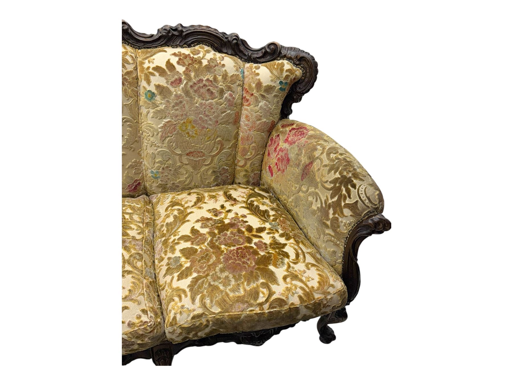 Victorian design stained wood three seater settee, top rail carved and scrolled, padded back and arms, scrolled cabriole feet 