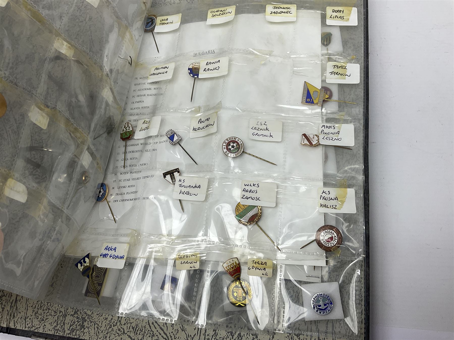 Large collection of approximately one hundred and eighty enamel badges and pins, relating to British and World football clubs, including loose examples and examples housed in folders, mostly identified