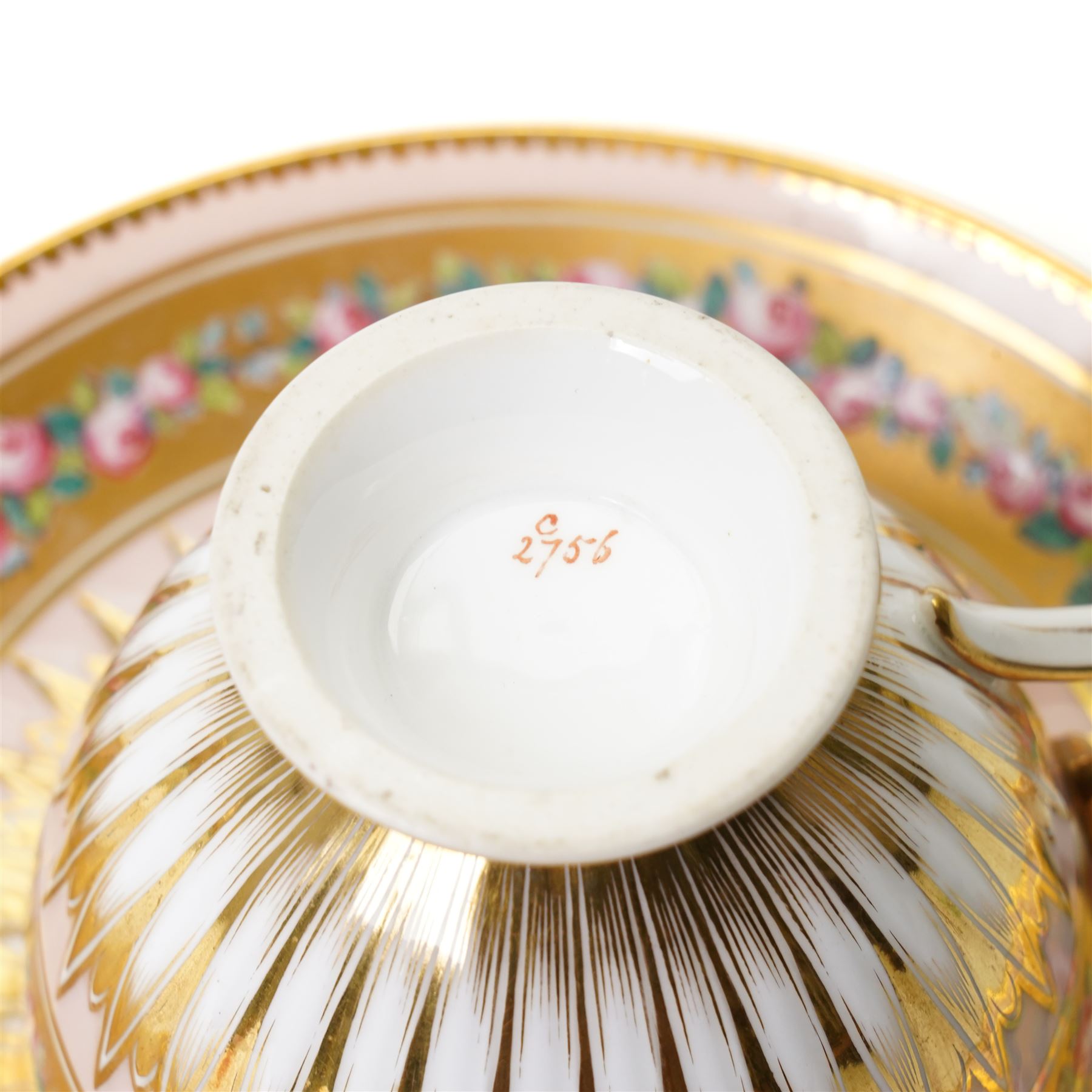 Brown-Westhead, Moore & Co cabinet cup and saucer, with rope twist moulded handle, hand-painted with floral reserves against a white and sky blue ground, heightened profusely with gilt, together with a pink hand-painted example, and a 19th century spill vase and twin-handled covered sucrier (4)