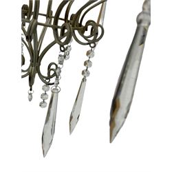 India Jane Interiors - six branch metal chandelier, the scrolled crown over circular bulbous body with six projecting branches, decorated with scroll work and glass pendants, in distressed white paint finish - ex-display/bankruptcy stock 