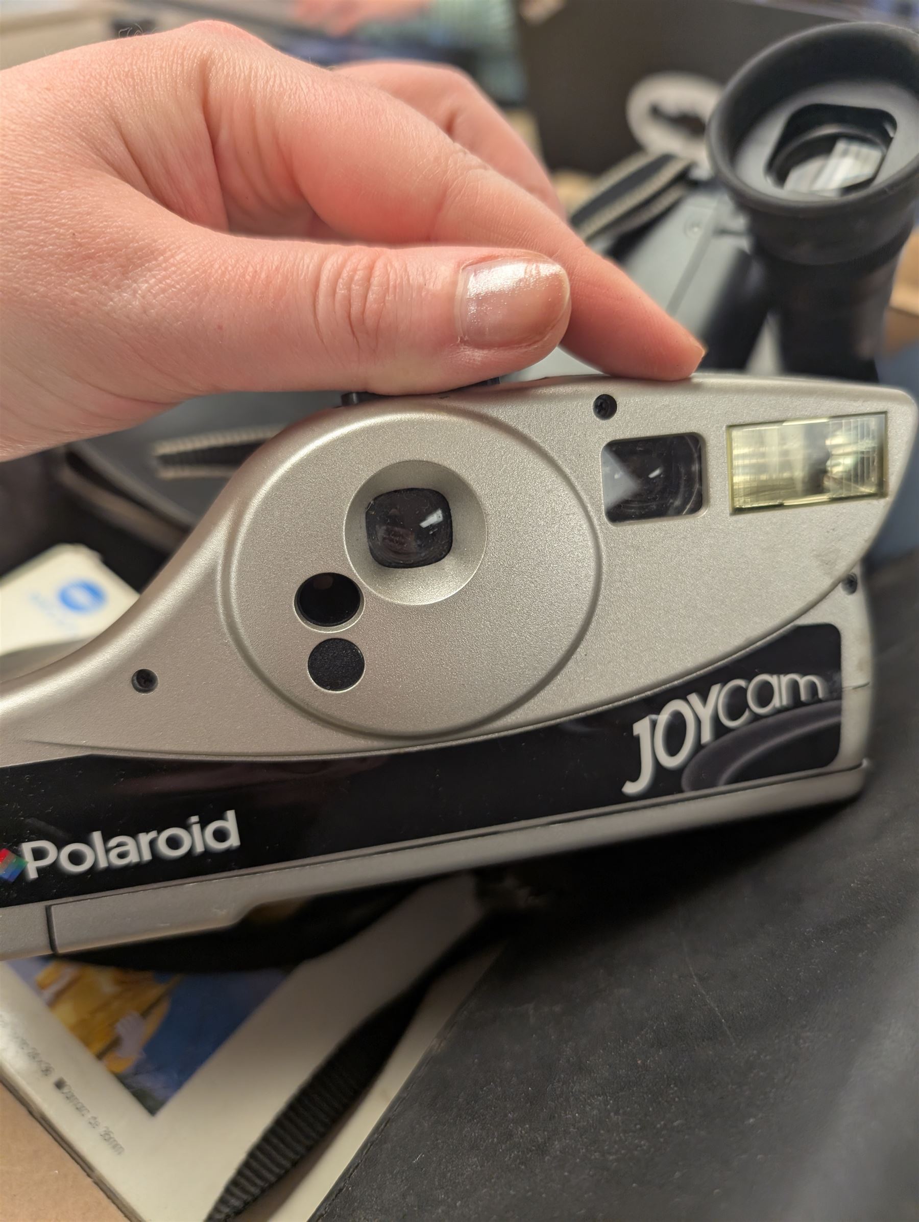 Collection of cameras, including Polaroid Joycam, Hanshing Cam digital camera, Kodak Pocket Instamatic 400, Mirage 20 cine cam, Polaroid Colorpak 80, Canon E230 camcorder, Minolta Weathermatic 35DL and a Canon Epoca camcorder