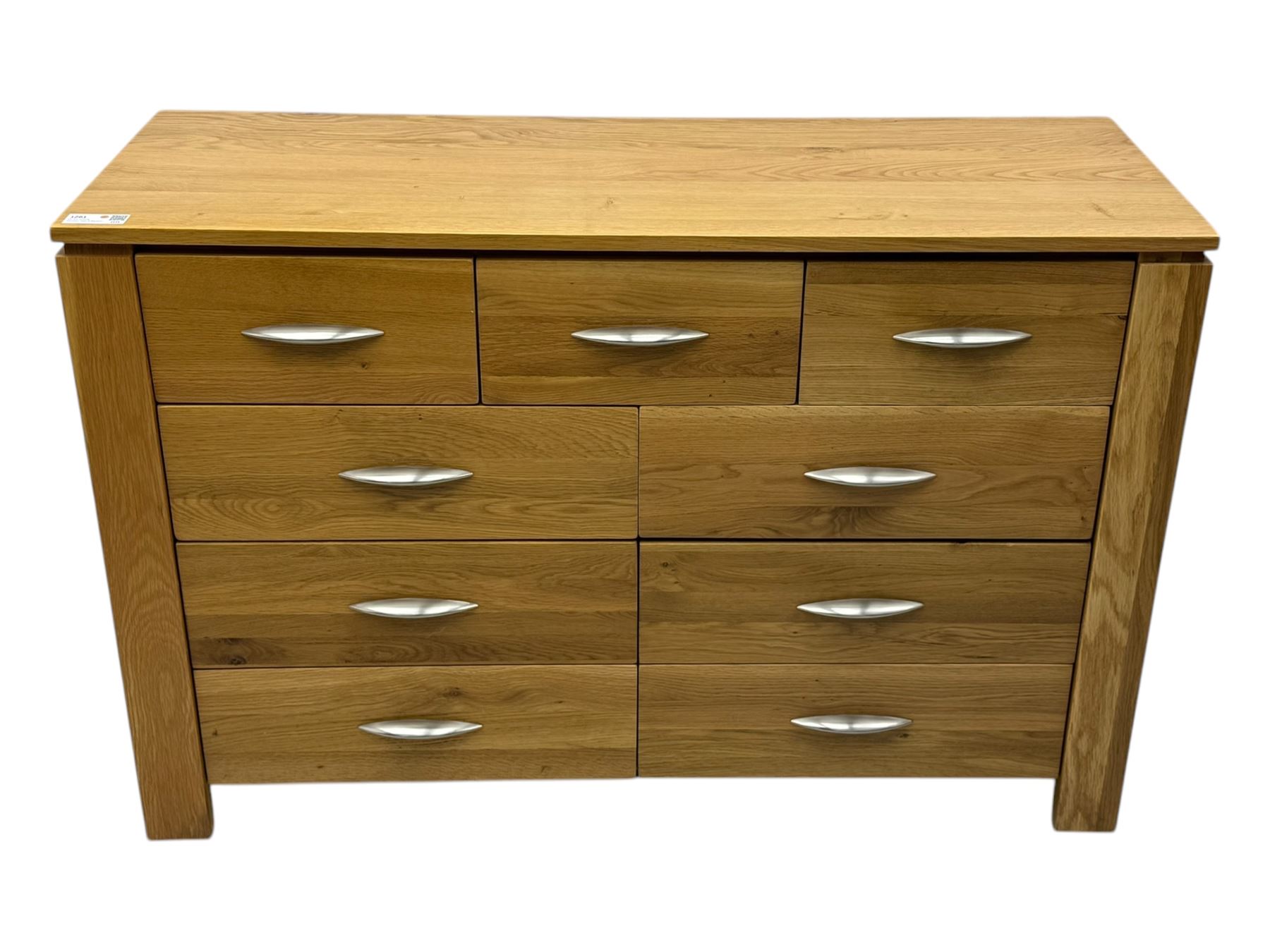 Contemporary light oak sideboard, rectangular top over three short and six long drawers each fitted with chrome handles, on plinth base