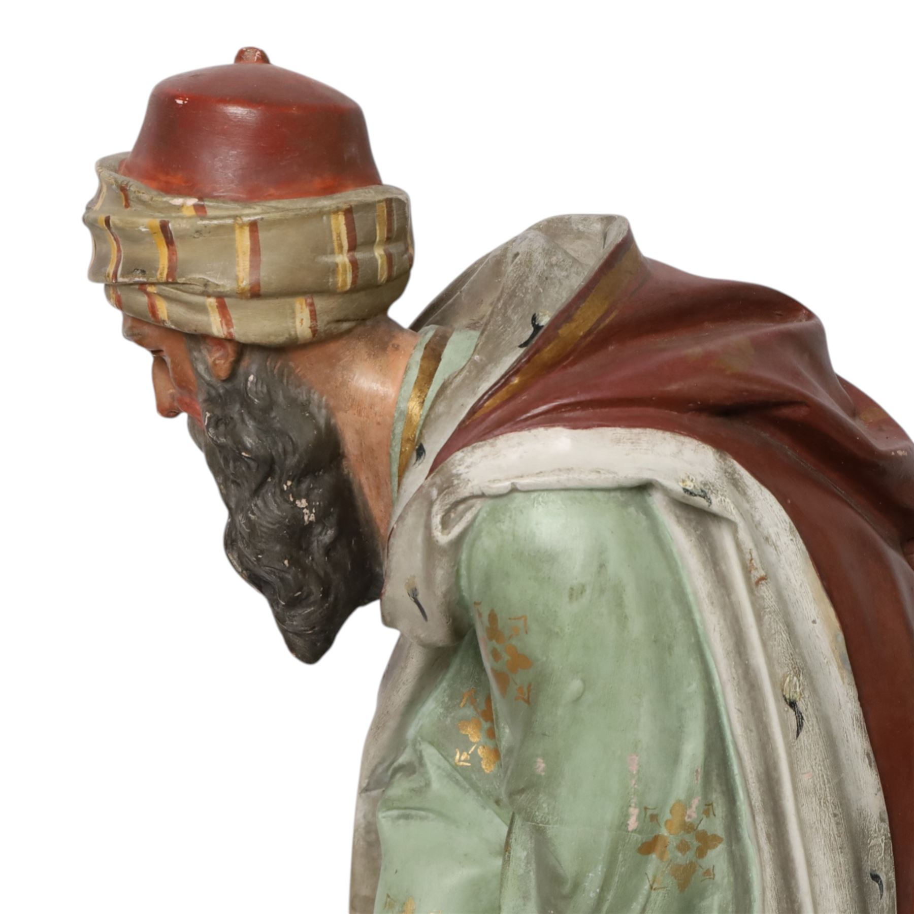 20th century painted plaster icon figure depicting one of the three wise men from a nativity sceen, kneeling and presenting his gift, H54cm 