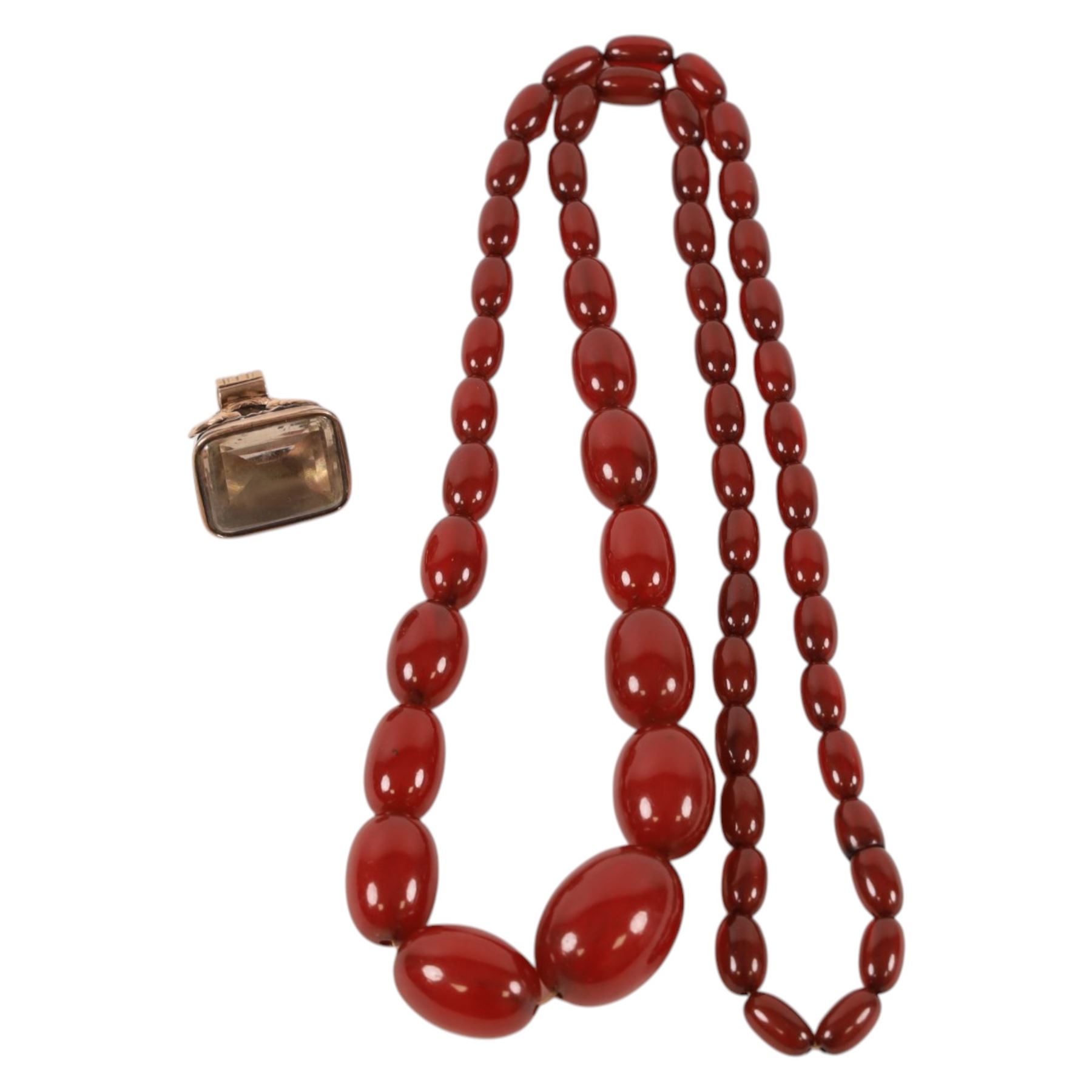 Cherry amber style beaded necklace and a gold plated seal fob