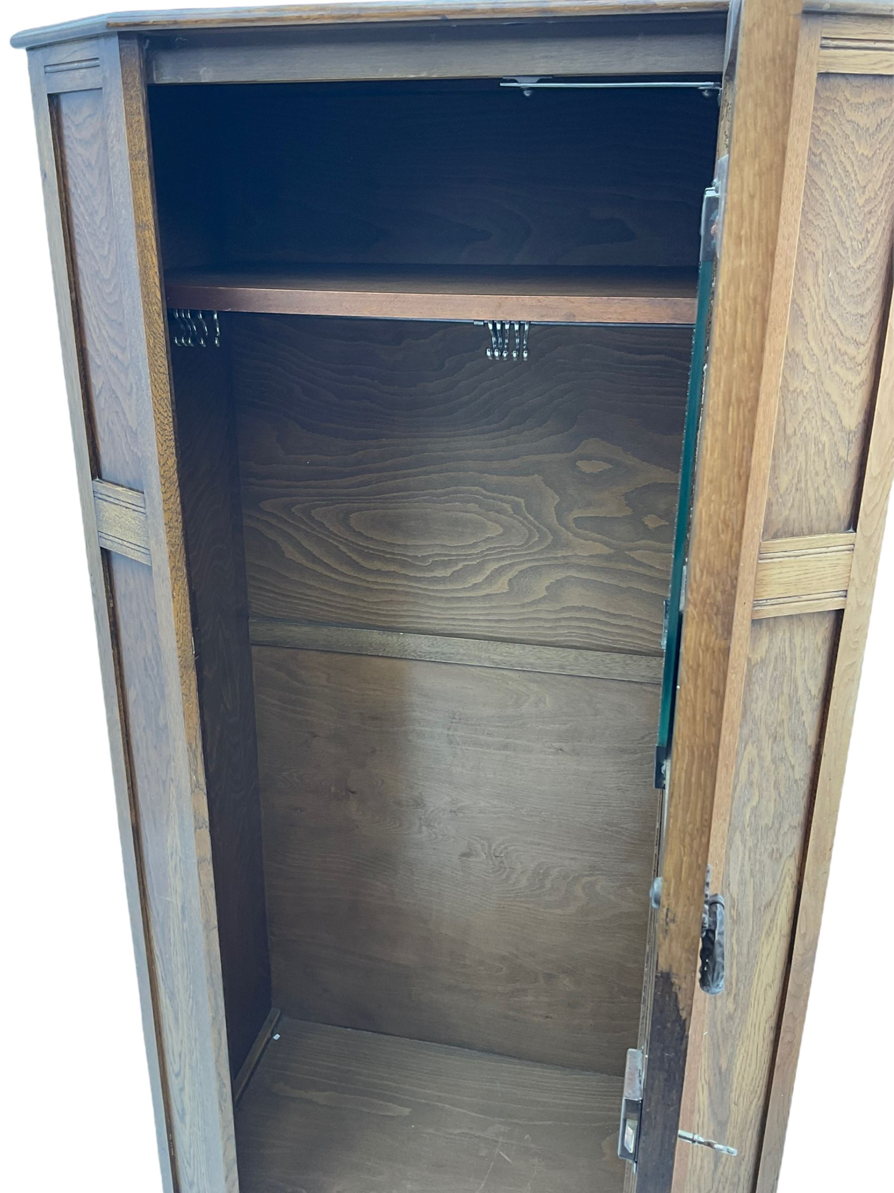Early to mid 20th century oak hall wardrobe, single door with linenfold panel