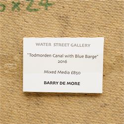 Barry De More (Yorkshire 1948-2023): 'Todmorden Canal with Blue Barge', oil and impasto on board signed, titled verso with Water Street Gallery label 61cm x 76cm
Notes: Acclaimed as one of the North's greatest expressionist artists, Barry De More (1948-2023) used a heavy impasto style to transfer his love of Yorkshire landscapes, townscapes and people to canvas. His work sits comfortably in the company of work by Kossoff and Auerbach, selling to collectors in the UK and overseas. De More's work can be found in the permanent collection of work by Northern Artists at Dean Clough, one of the UK's largest contemporary art galleries.