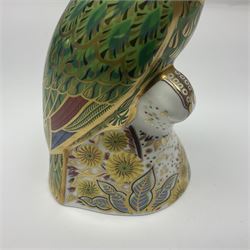 Two Royal Crown Derby paperweights, comprising Amazon Green Parrot, limited edition 1639/2500, with gold stopper and White Swan, with silver stopper, both with printed mark beneath and original box