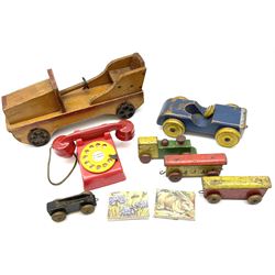 Vintage wooden toys including laundry set of washboards, clothes horse and tin wash-tub; scratch-built vehicles; building blocks; toy sweeping brush; skittles; spade; 'Titanic' deck chair; bee hive etc
