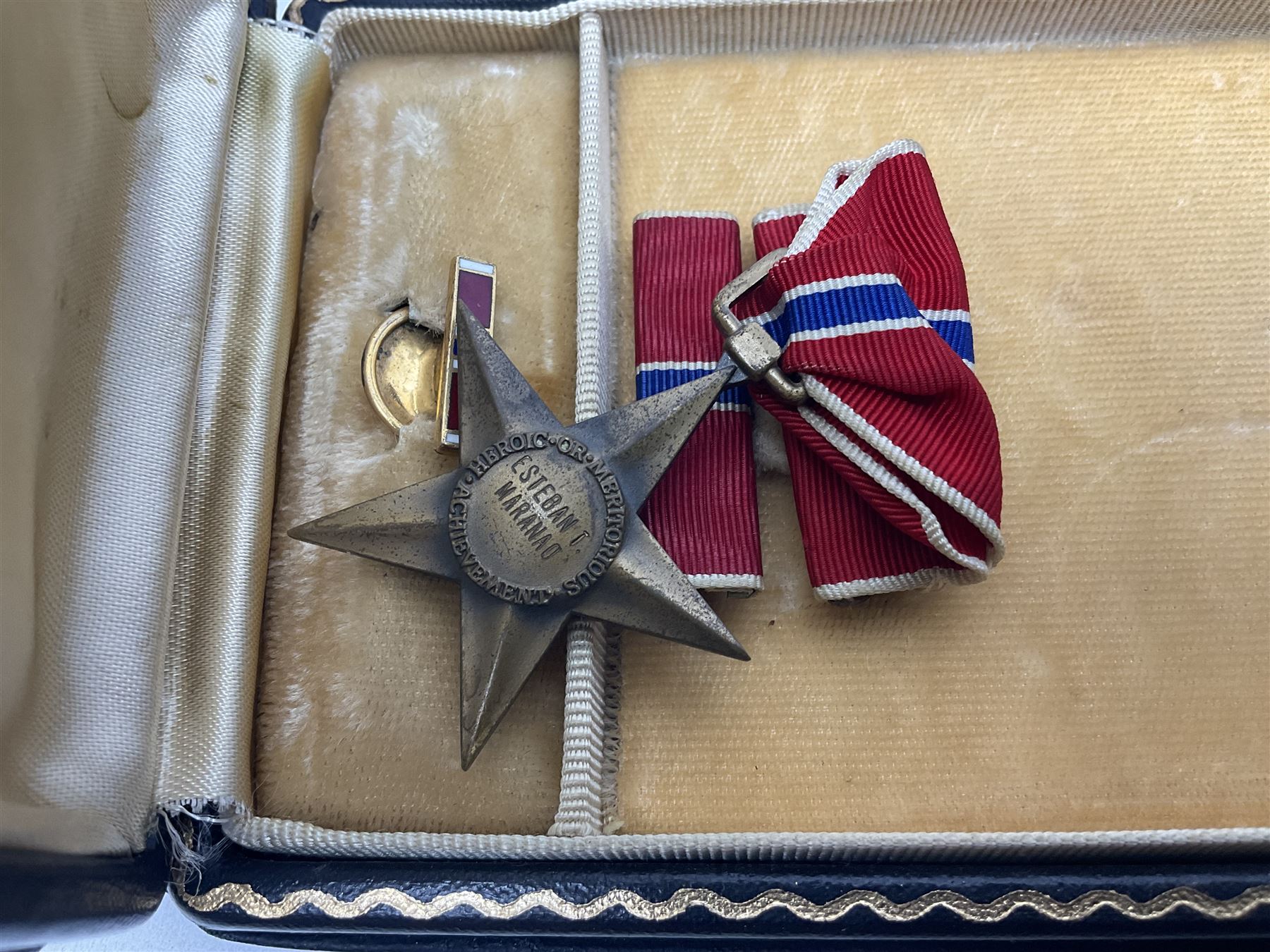 American Purple Heart Medal awarded to 32634848 Charles H. Poppo; cased with identity tags and paperwork; and Bronze Star Medal awarded to U.S. Marine Esteban T. Maranao; cased; American WWII Victory Medal and Asiatic Pacific Campaign Medal