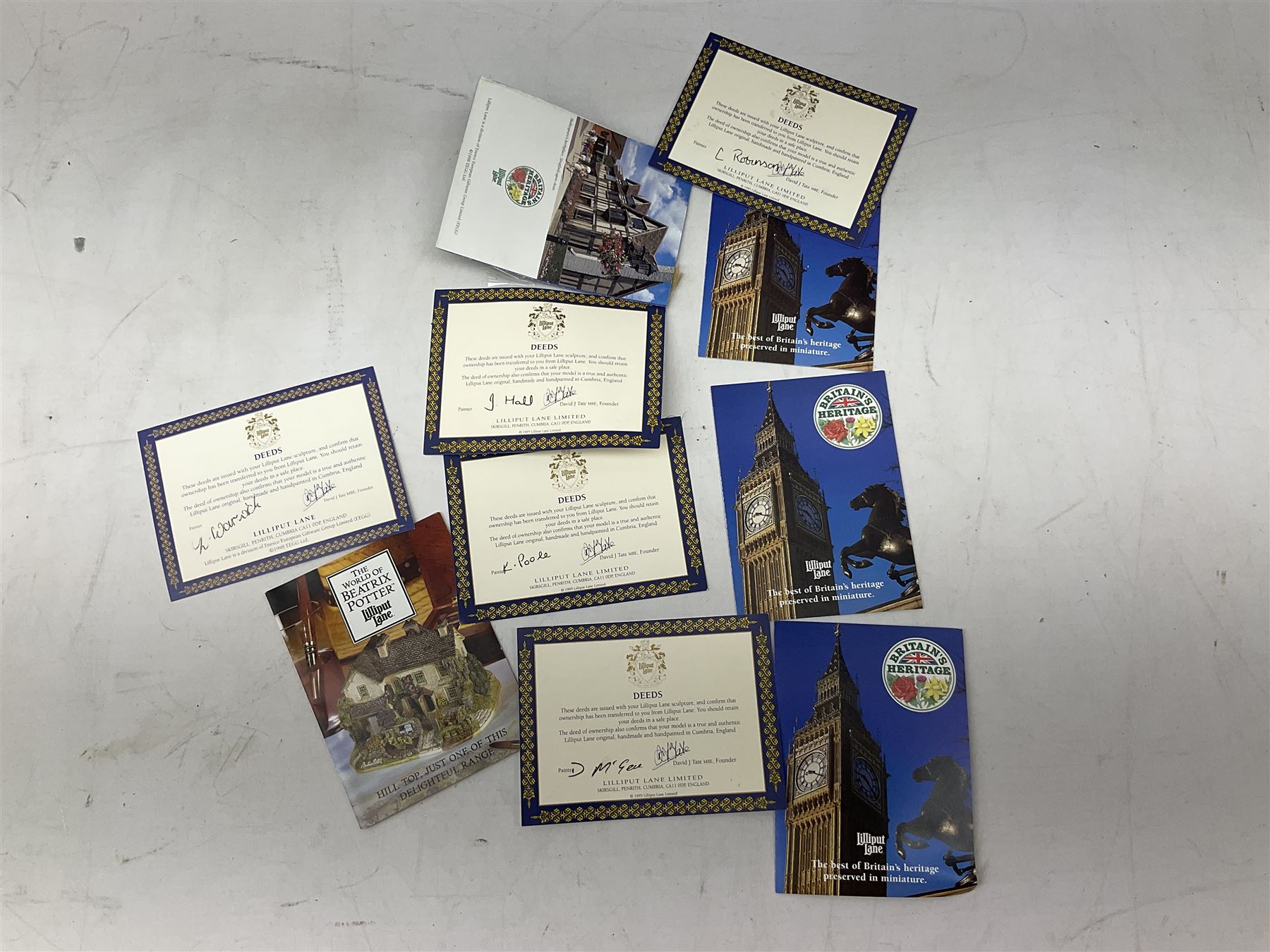 Four Lilliput Lane models from the 'Britain's Heritage' collection, comprising Edinburgh Castle, The World Famous Blacksmith's Shop Gretna Green, Shakespeare's Birthplace and Mickelgate Bar York, together with  a Lilliput Lane Beatrix Potter Hill Top model, all boxed