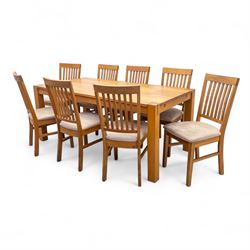 Contemporary solid oak rectangular dining table, with two additional extension leaves, together with eight matching high back dining chairs upholstered in cream suede-effect fabric (9) (Chair H 95cm, W 41cm, D 53cm) (Extends to 270cm)