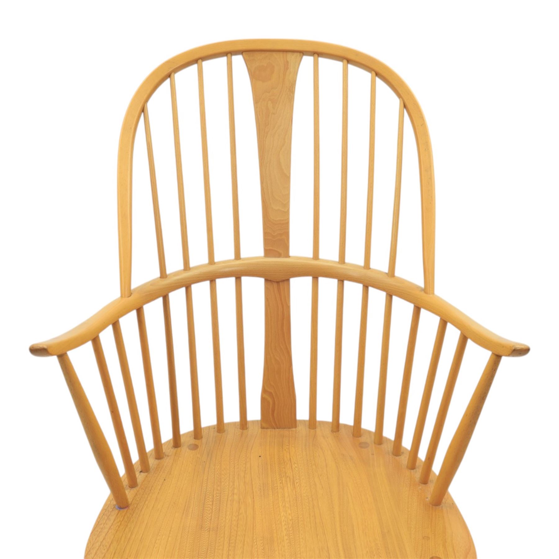 Ercol - Windsor 'Chairmakers' light ash armchair, with traditional spindle backrest, above a dished seat, with cylindrical supports united by a carolean stretcher
