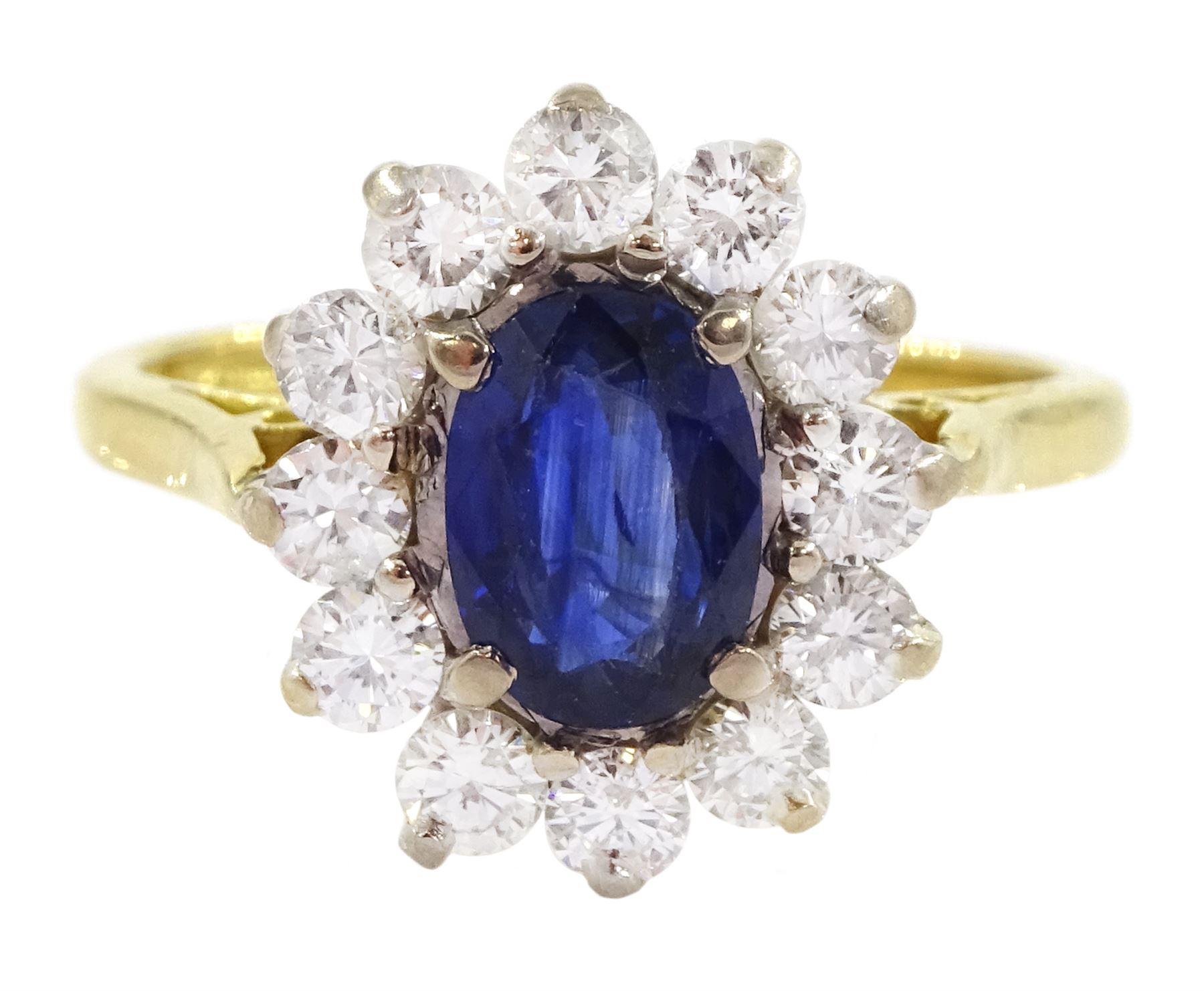 18ct gold oval sapphire and round brilliant cut diamond cluster ring, Birmingham 1994, sapphire approx 1.00 carat, total diamond weight approx 0.70 carat