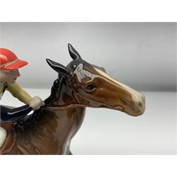 Beswick jockey on walking horse no 1037, in black white and yellow jockey colours, with printed mark beneath, H22cm