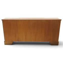 Georgian design figured and burr walnut breakfront sideboard, shaped rectangular top inlaid with crossbanding and stringing, fitted with central brushing slide over cupboard enclosing single adjustable shelf, flanked four graduating cock-beaded drawers to each side, raised on bracket feet