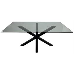 Contemporary glass and metal dining table, rectangular glass top on black finish steel X-framed base