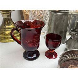 19th century cut ruby glass engraved A Present from Scarborough, with single handle, two decanters, two silver plated wine bottle coasters, collection of pewter tankards, brass oil lamp, copper mushroom repousse plaque and barometer
