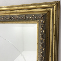 Gilt framed bevel edged wall mirror with oval centre , W93cm, H68cm