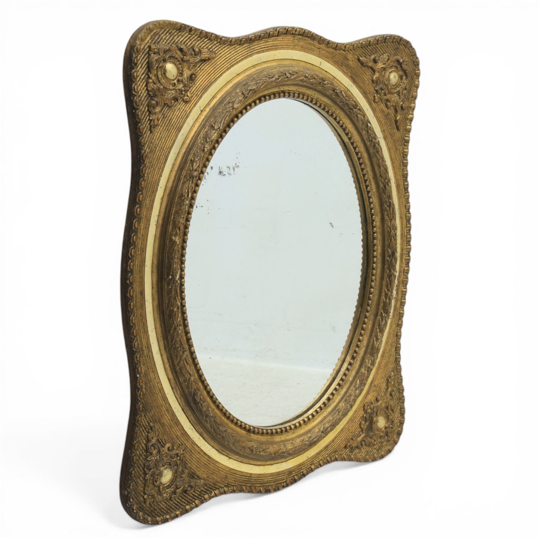 Early 20th century giltwood mirror, oval mirror plate, surrounded by egg and dart moulding, with foliate motifs