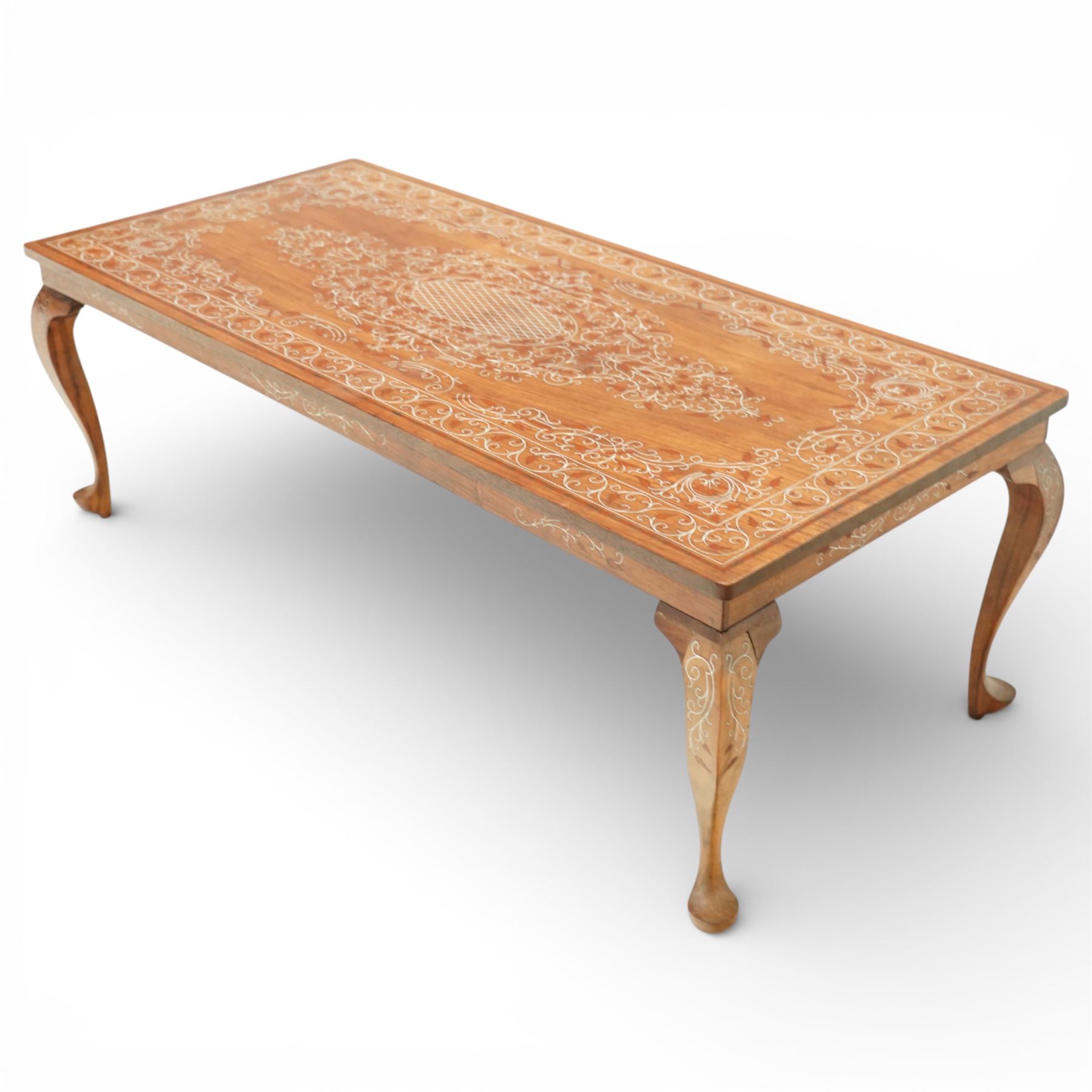 20th century Indian style bone inlaid coffee table, rectangular top profusely inlaid with scrolling foliate decoration centred by an oval medallion, matching inlay to the frieze and cabriole legs, raised on shaped feet
