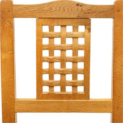 Beaverman - 1980s set of four lattice back dining chairs, shaped top rail above a lattice back, green leather fixed seat, raised on octagonal front supports, with carved Beaver to the back stretcher, by Colin Almack of Sutton near Thirsk