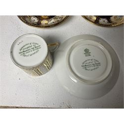 Paragon thee coffee cans and saucers, painted in gilt and colours with flowers, Paragon set of six coffee cups and saucers, 'Reproduction of Service accepted by Her Majesty Queen on her visit to the potteries, with three matching saucers