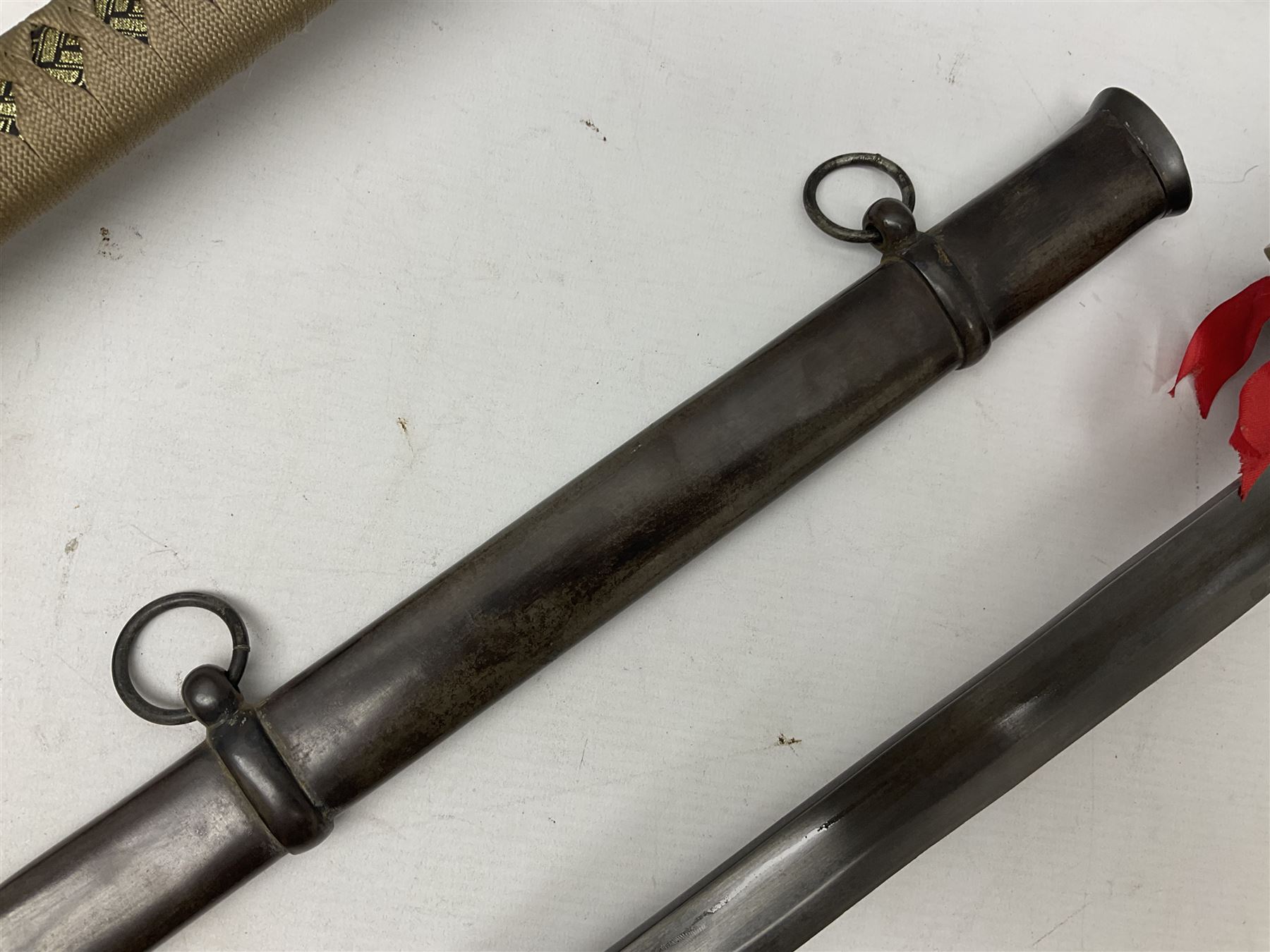 Reproduction Scottish officers basket hilt broad sword, the brass basket pierced with heart-shaped motifs lined with red lining, together with a reproduction Japanese Katana sword, longest L110cm