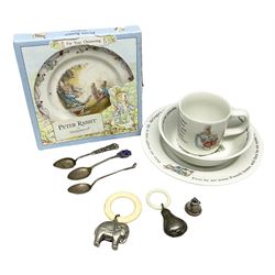 Silver enamel Whitby souvenir spoon, another hallmarked silver spoon and hallmarked silver bell oddment, two silver-plate baby rattles, Wedgwood Peter Rabbit nursery plates and bowls and cup