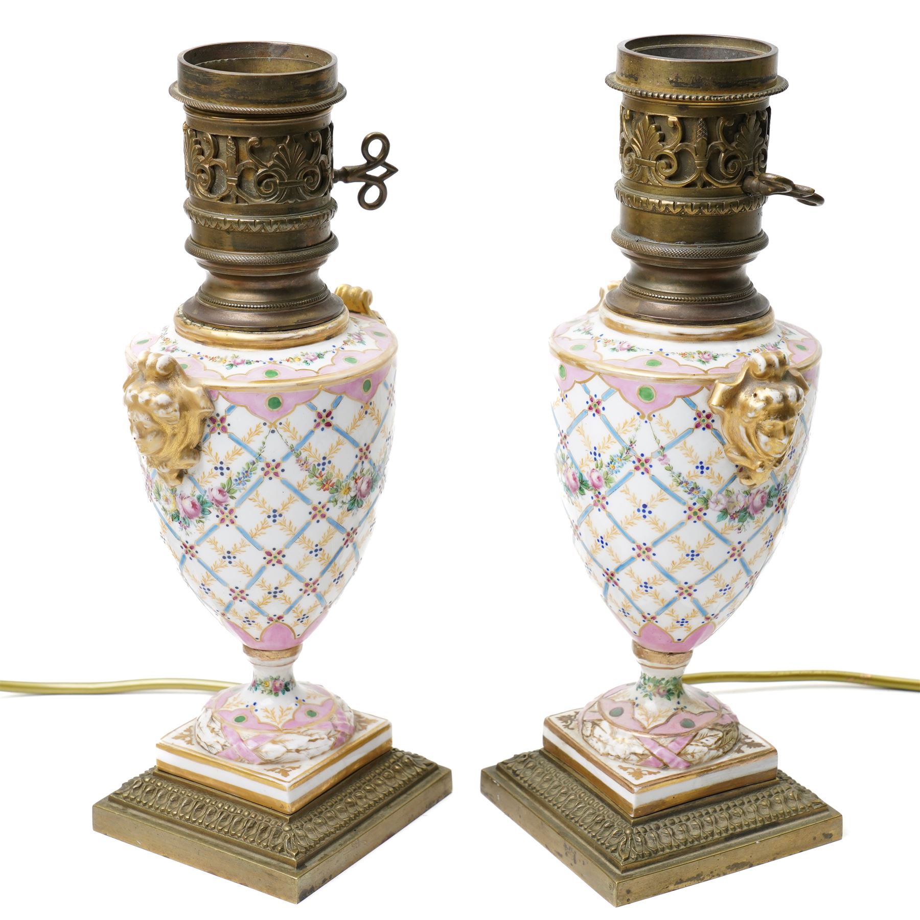Pair of Sevres style table lamps, with pink and gilt floral decoration, apocryphal marks to bases, H32cm (2)