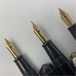 Three Conway Stewart fountain pens, comprising Cracked Ice 28 pen, the black and pearl white barrel engraved Conway Stewart 28 and double banded cap, with gold nib stamped 14ct, together with a Conway Stewart 75 lever fill pen, the green marble barrel and cap with single band and gold nib stamped 14ct and Conway Stewart 55 lever fill fountain pen with black barrel and cap with single broad band and two narrow bands with gold nib stamped Duro 14ct, largest L13cm