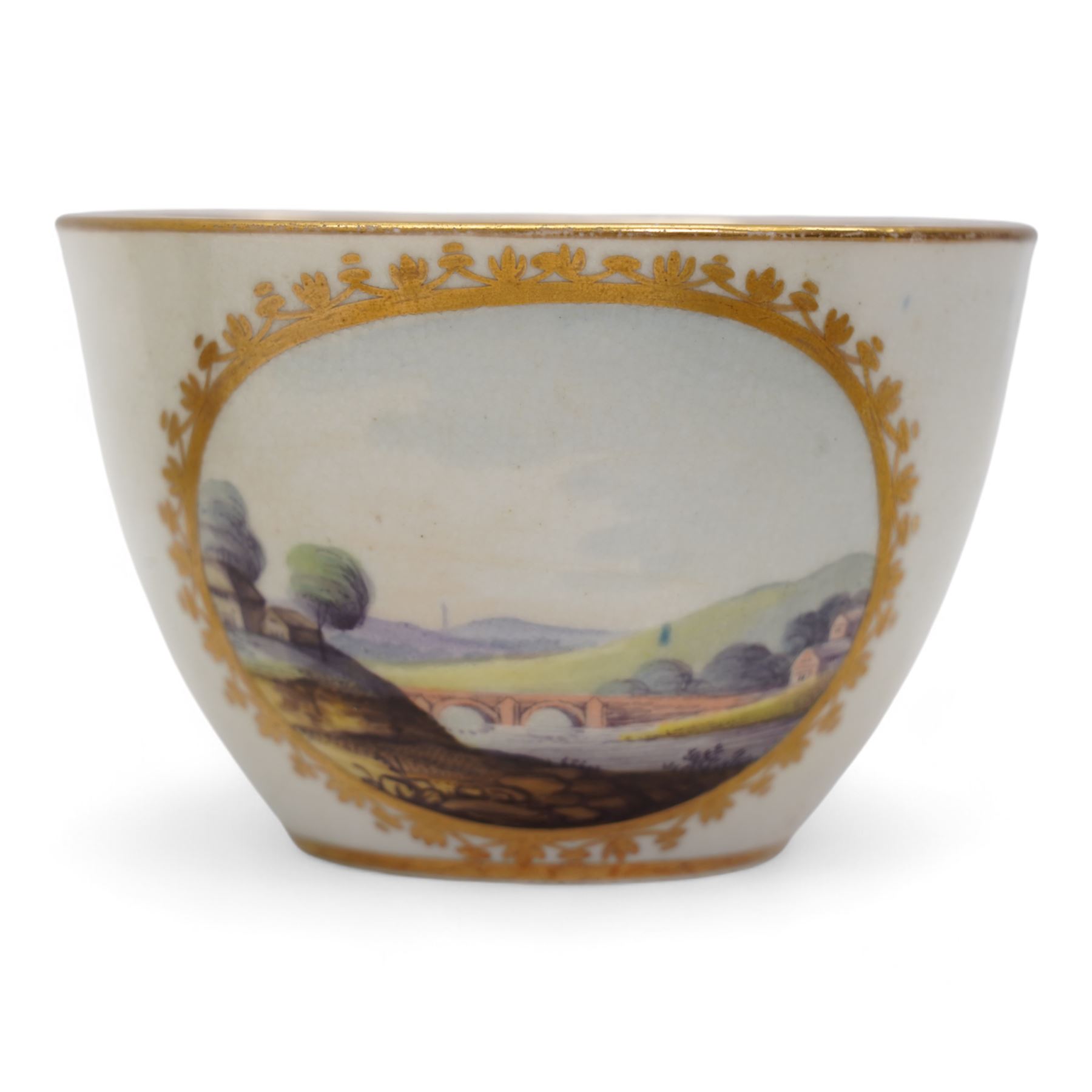 Set of four Pinxton porcelain bute shaped teacups and saucers, circa 1796-1813, pattern no. 58, painted in polychrome with circular landscape panels within gilt husks and sprigs, all saucers numbered 58 beneath, saucer D14cm, teacup H6cm (8)