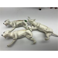 Beswick hunting group, comprising huntswoman on dappled grey horse no 1730, huntsman on bay horse no 1501, two fox figures no 1440 and 1748, and four fox hounds, all with printed marks beneath (8)