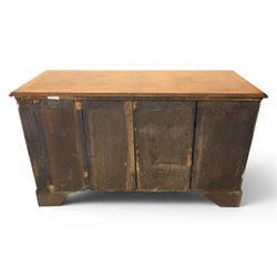 Traditional design walnut inlaid chest, with figured top with circular inlay and crossbanded top with moulded edge, figured drawers with cockbeaded edges and brass handles, raised on bracket feet