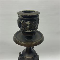 Pair of Grand Tour style bronze candelabra, each with trefoil base supporting three paw feet and base cast with fruiting vines, leading to a fluted column with central nozzle with conforming fruiting vine detail above drip pan, and supporting three curved branches with confirming sockets and drip pans, H34.5cm