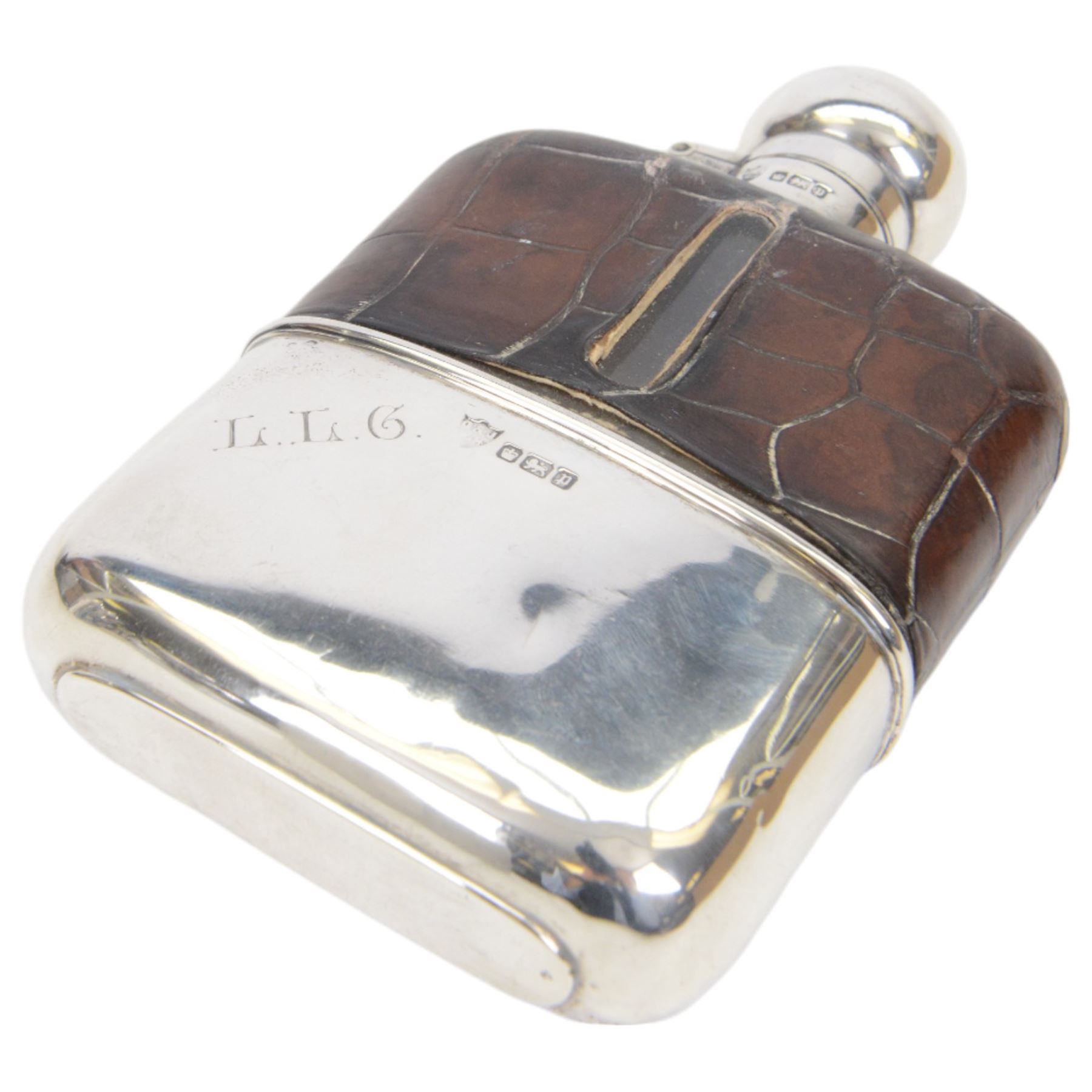 Edwardian silver mounted hip flask, the glass body overlaid with crocodile effect leather, with silver collar, cap and removable cup engraved with initials, all hallmarked G & J W Hawksley, Sheffield 1907, H13cm