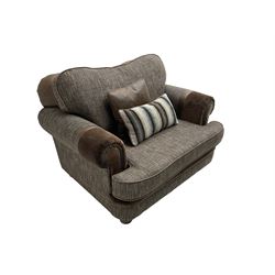 'Canterbury' snuggler sofa upholstered in brown fabric with contrasting textures, traditional shape with scrolled arms and studded bands, on turned feet