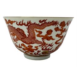 Chinese porcelain iron red tea bowl, the exterior painted with two five claw dragons chasing the flaming pearl, amidst clouds, red Quinlong seal mark beneath, D10.5cm x H6.5cm