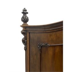 Early 20th century Italian walnut armoire wardrobe, the pierced and scrolling pediment carved with acanthus leaf detail, flanked by two scrolling cartouche with matching corbels below, the two panelled doors with applied carved rinceaux slips, with a central spiral turned upright, enclosing single shelf and hanging rail, raised on scroll feet