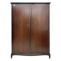 Stag Minstrel - mahogany double wardrobes, comprising a larger wardrobe with a shelf and h...