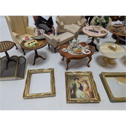 Dolls house furniture, including sofa, chairs, foot stools, fireplace, sideboards, five figures, mirrors, paintings and accessories