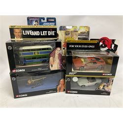 Corgi - The Definitive Bond Collection and The Director's Cut - nine die-cast vehicles from You Only Live Twice, Goldfinger, For Your Eyes Only, Diamonds Are Forever etc; Corgi Classics Moonraker Shuttle and Lotus Esprit; two other Corgi James Bond packs; Carrera Die Another Day Aston Martin V12 Vanquish; nine Johnny Lightning carded James Bond vehicles; Dragon carded Wai Lin figure; and three Fabbri tanks; all boxed/packaged (27)