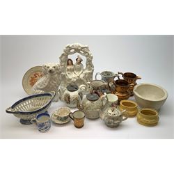 A group of 19th century ceramics, comprising agateware teapot with pewter cover, the body detailed with verse, a further example detailed A Present from Blackpool, large Wedgwood best composition mortar, two copper lustre jugs and a small cup, floral print decorated jug possibly Don Pottery, Gaudy Welsh jug, floral painted mug, Staffordshire nursery plate, teapot, and teacup and saucer, reticulated chestnut basket, Staffordshire bough group, plus a later Staffordshire style dog. (9). 