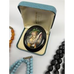 Whitby jet hand painted Tyrolean boy brooch, silver mounted ebony glove stretchers hallmarked, 19th century fan, turquoise bead necklace and brooch, amber type necklace, gilt chains, jade bead necklace, 19th century ivory letter opener